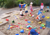 Children playing outside in the sand